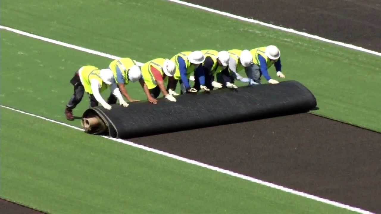 Memorial Stadium field turf install - YouTube