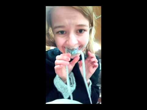 Girl eats whole live octopus