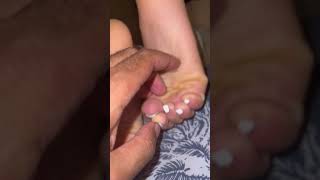 Timing how long it takes for her feet to be less ticklish