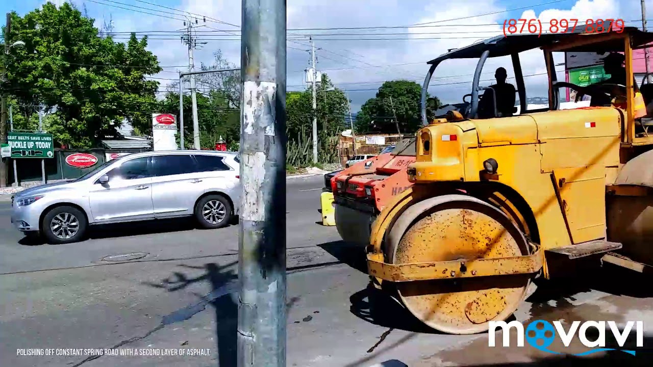 Polishing off constant Spring Road, second layer of asphalt.