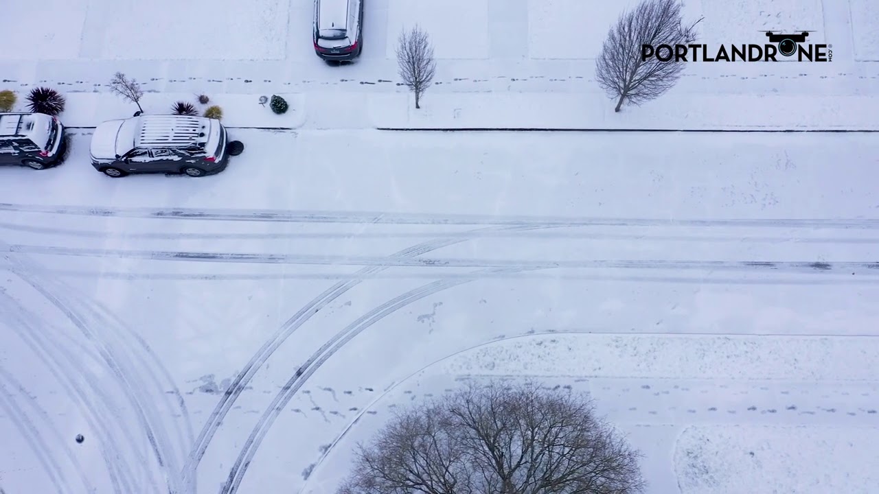 Aerial views of a snowy North Portland morning