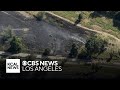 Brush fire fueled by strong winds in Van Nuys