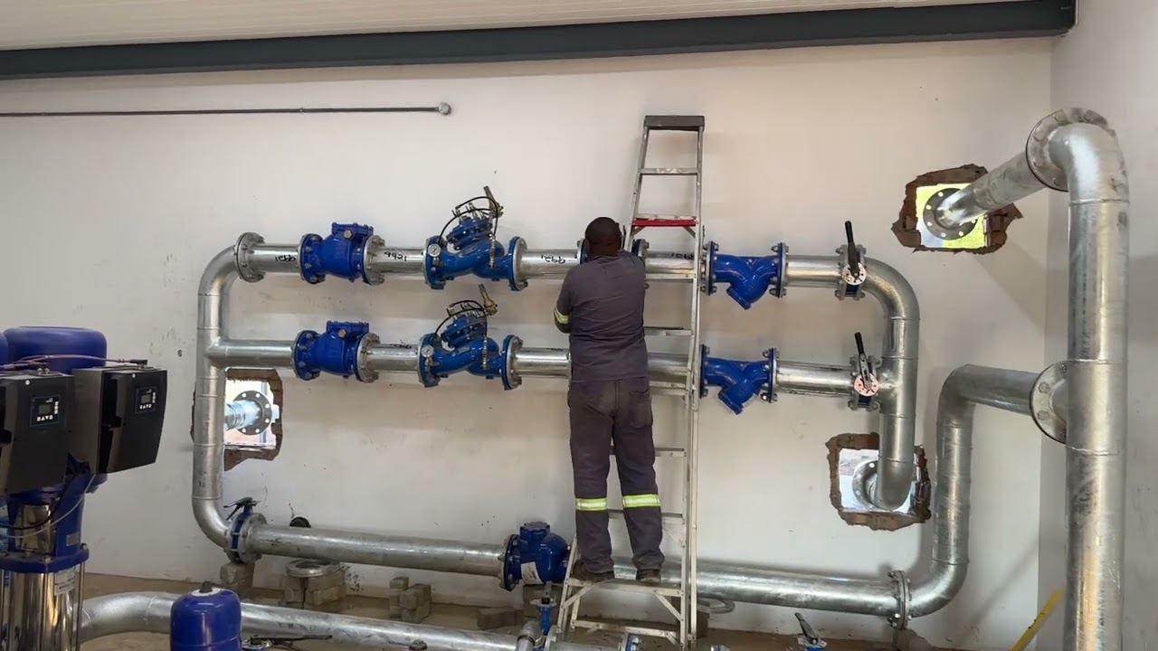 Connecting water pumps with pipe and fittings. 