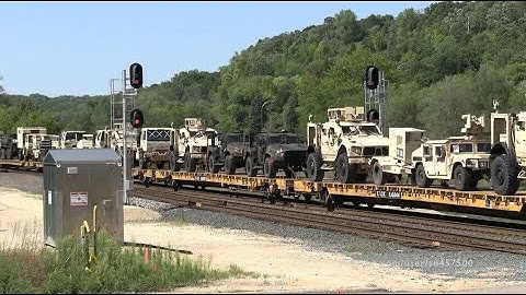 Military Train loaded with tanks, artillery, and other equipment on the BNSF Railway -Drone views-