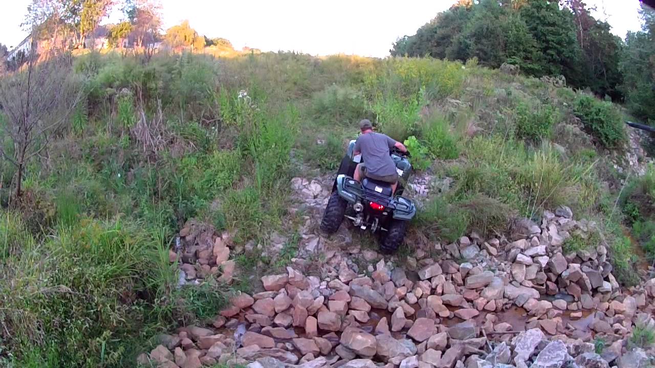 2013 Stock Rancher 420 climbs rocks - YouTube