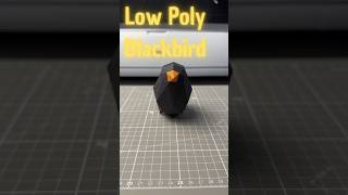 Cute low poly blackbird made of paper