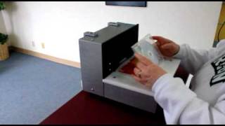 Automatic DVD Case Opener for Libraries by ERGOdynamics