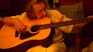 Hazel Pearson Playing Her Guitar.