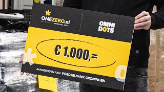 Donating a check of one-thousand euros to the food bank in Groningen
