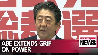 Japan's Abe re-elected as party head, to stay on as PM