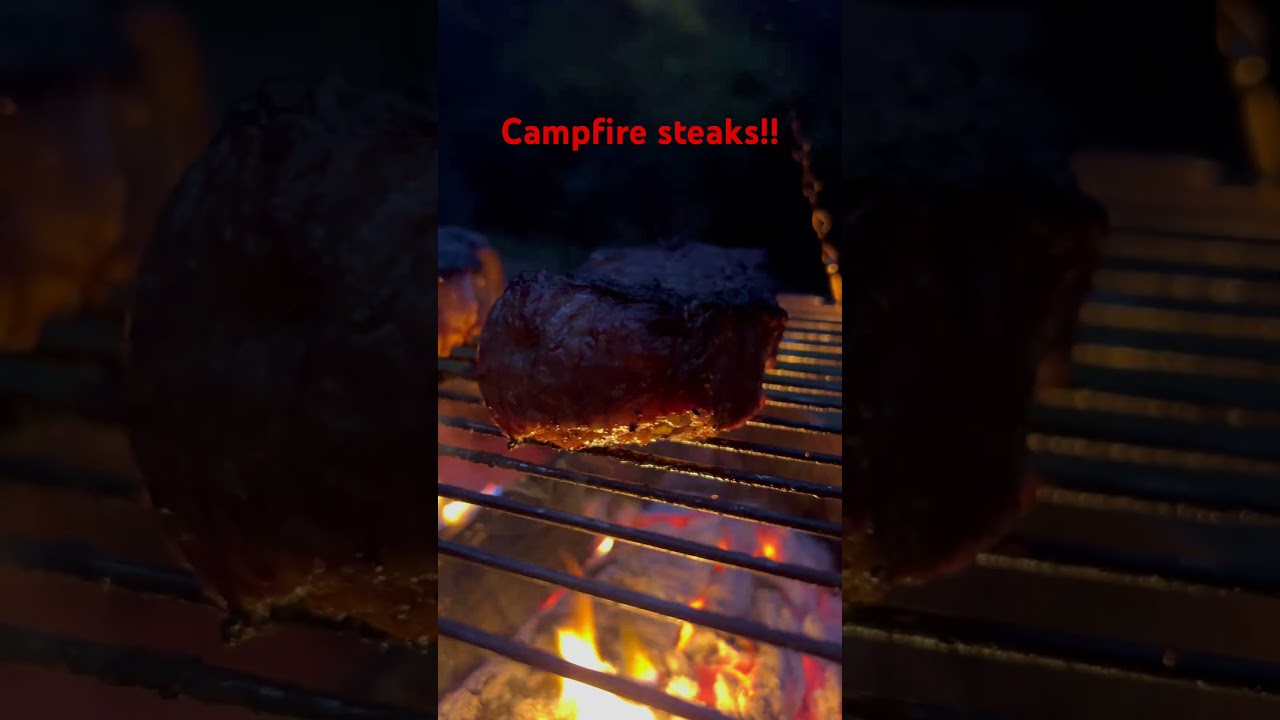 Big old steaks over oak wood fire 