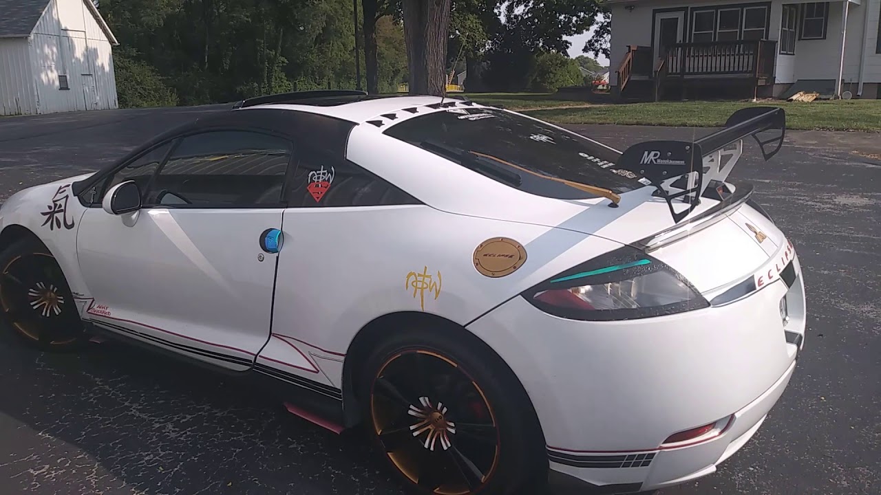 Artist at work..i added gold paint to my rims.. Calvin's 4G eclipse ...