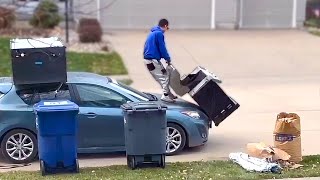 Man Loads a Grill onto the Roof of His Car