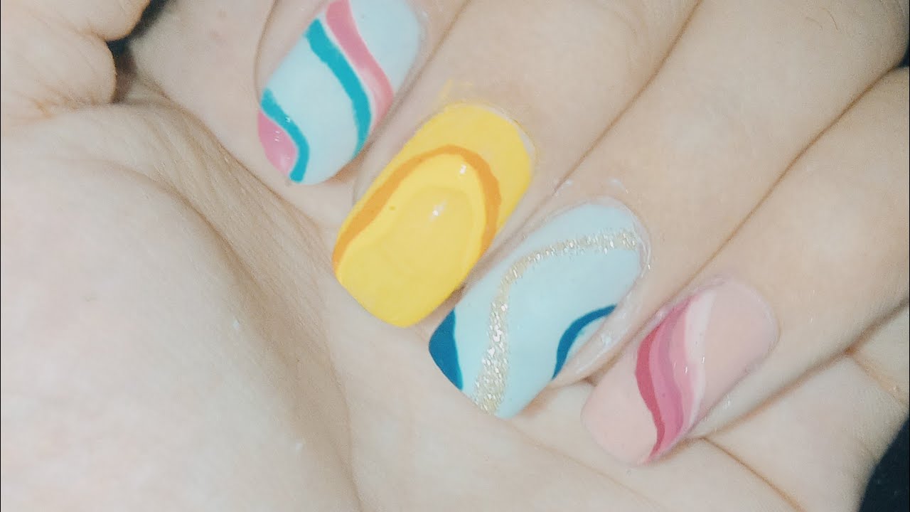 10. Rainbow Swirl Nail Art Design - wide 2