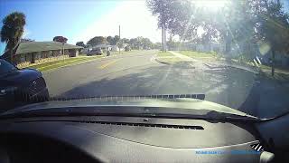Driver Runs Stop Sign and Nearly Hits Car at Intersection