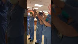 Hospital staff cheer as COVID patient is discharged