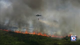 Large brush fire continues burning in south Miami-Dade