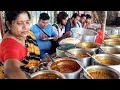 Expert aunty manage everything selling paratha and rice with variety types of curry's