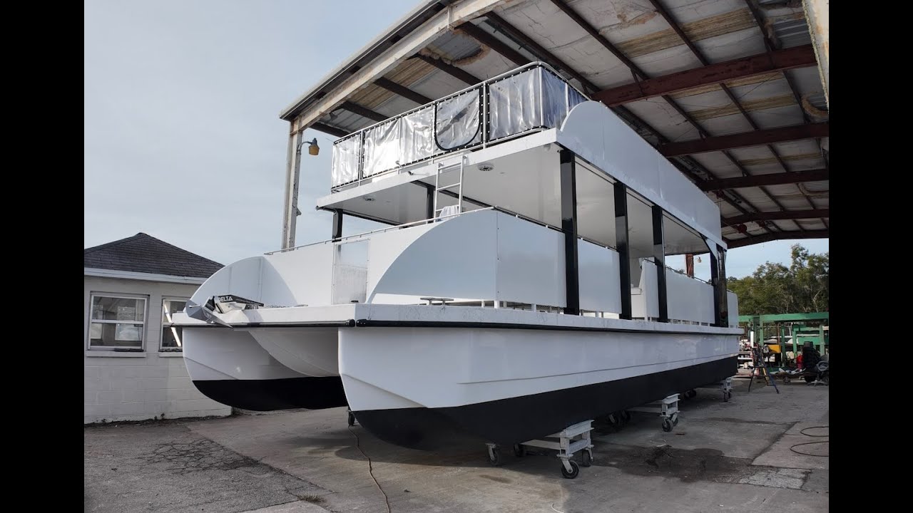 Check out our Double Decker 43 on fiberglass pontoon hulls! This passenger boat can carry 49 client!