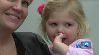 Newborns get tiny red hats in honor of Congenital Heart Defect Awareness Week