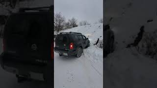 Xterra  por-4x climbing a snowy hill Xterra Pro4x Hill Climb