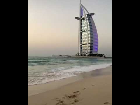 Jumeirah Beach, Dubai, Enjoy roaring sea with Burj Al Arab Hotel seen in  backdrop at Dubai