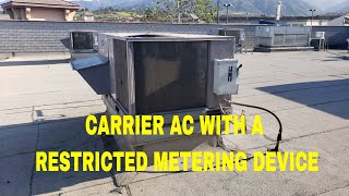 CARRIER AC WITH RESTRICTED METERING DEVICES