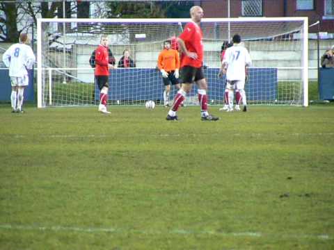 A waterlogged pitch at Kellemargh Park meant that the tie was switched to the ground of Squires Gate FC. With the score at 1-1 it looked as though the two rivals would once again be heading toward extra time when the referee awarded a penalty to the visitors. This video shows the penalty converted and Needham Market FC hung on and went though to the last eight of the competition.