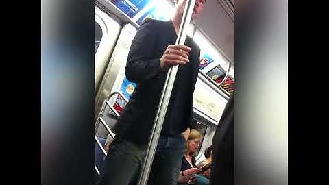 Do you recognize this man who gives up his seat to a woman on the subway?