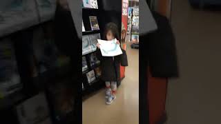 She want to buy the coloring book at meijer