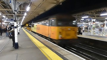 Class 66 + 56 56051 passing Basingstoke with speed! 19/11/2025.