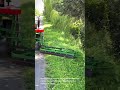 Mechanical Grass Trimming Along Highway Shoulder