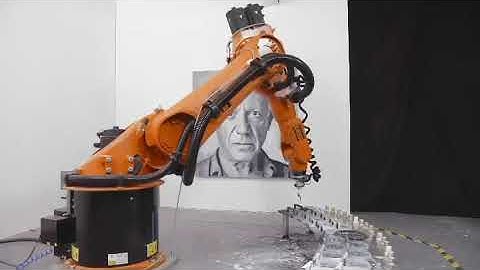 Robot Paints Portrait of Artist on Canvas - 1140171