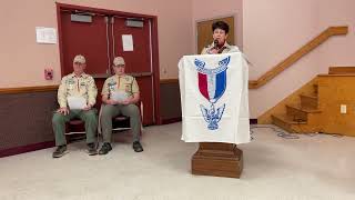 Mrs Kinsley announces John has successfully achieved the Eagle Scout rank at Court of Honor
