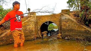 Removing Stone And Trash Clogged Culvert