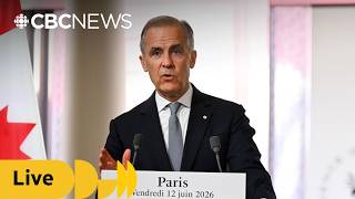 Carney takes media questions in Paris