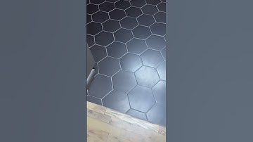 Tiling kitchen floor with flat black hexagon tiles, looks awesome but shows dirt 🥲 #tileideas #diy