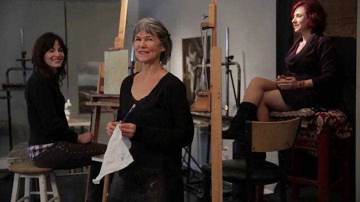 Sherrie McGraw paints a portrait at the Kline Acad...