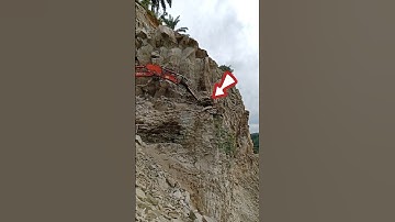 Amazing excavator!! breaking rocks from the edge of a cliff #excavator #viralshort#automobile#shorts