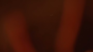 One Particle Orbiting Another, front