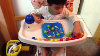 2 Year old/ 25 months old child,Moksh plays with a creative peg board by Plan Toys
