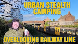 URBAN STEALTH CAMP OVERLOOKING BUSY RAILWAY LINE