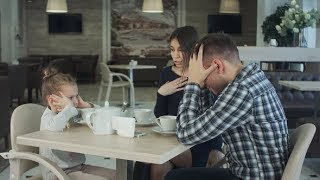 Couple Fighting in Front of Child at Cafe or Restaurant. Daughter Closing Her Ears Not To Leastning