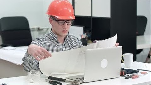 Engineer Explaining Technical Drawing During Video Call Via Laptop | Stock Footage - Videohive