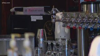 Owners dispute when texas bars, massage parlors should re-open