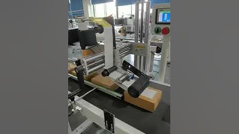 Automatic labeling machine for box packing.#ecommerce #packing #warehouse #logistics
