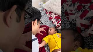 Cute baby talking to dad