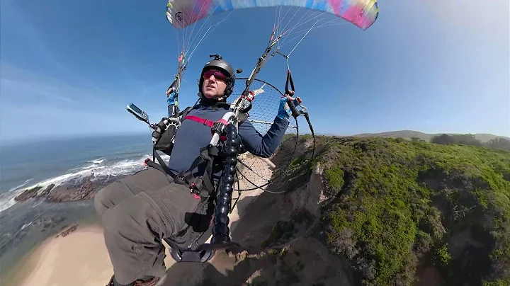 Paramotor flying along the ocean cliffs