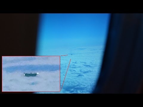 UFO Flies By Plane Window In London UK, May 25, 2014 In The Morning