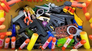 Box Full of Bombs and Weapons - Toy BB Guns - Weapon Equipment